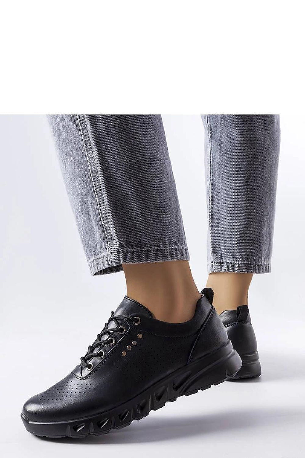 Solea black leather Brodeur sneakers, demonstrating a blend of luxury and comfort designed for summer outings.