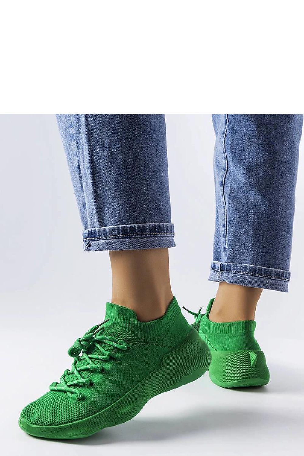 Elegant Côté green sneakers showcasing a modern design, perfect for summer fashion.