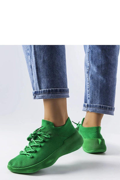 Elegant Côté green sneakers showcasing a modern design, perfect for summer fashion.