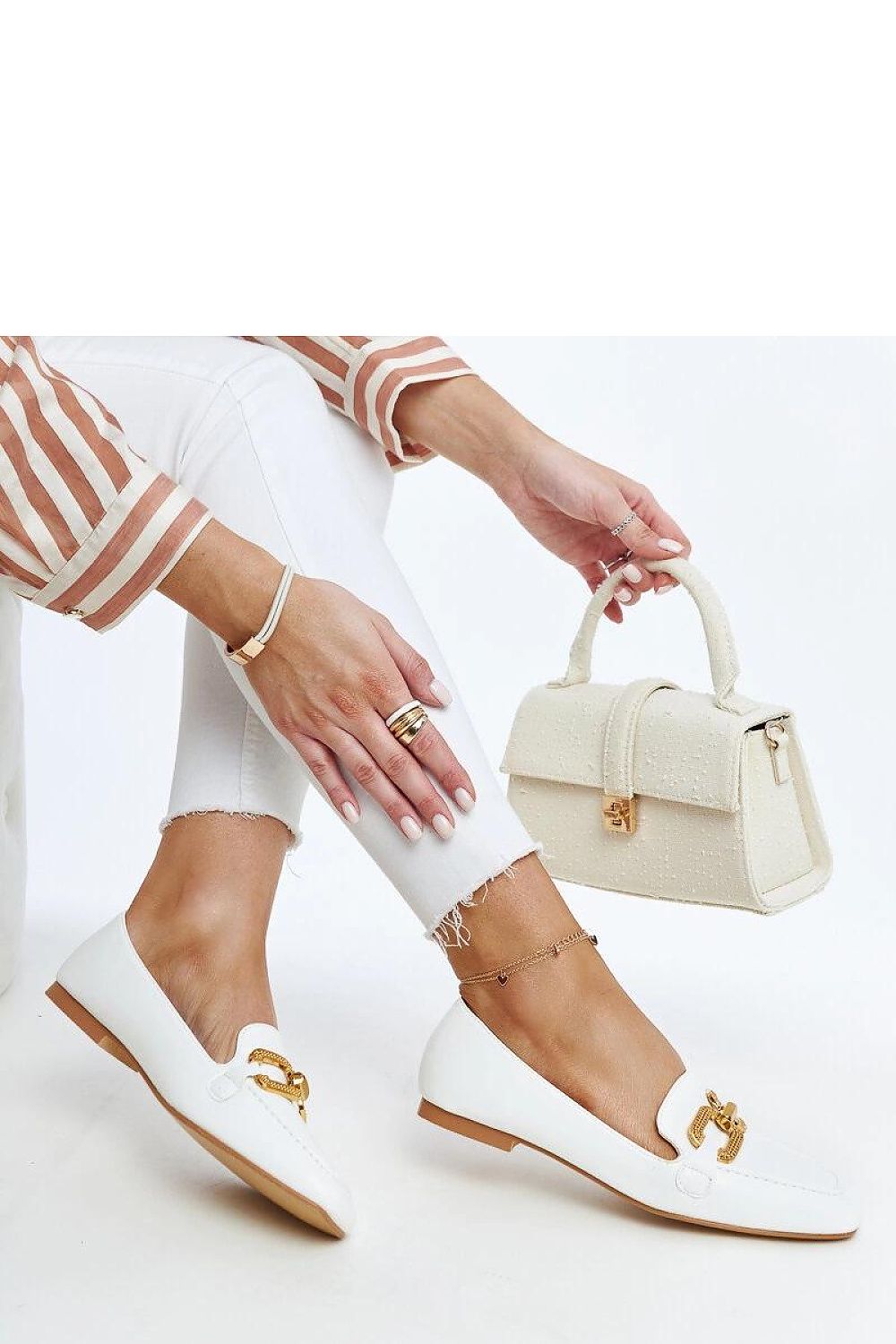 Close-up of Solea luxe moccasins, showcasing the intricate stitching and plush foam lining for enhanced comfort.