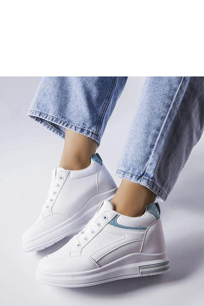 Close-up of Solea's luxurious black sneakers with sequins, showcasing the exquisite detailing and white rubber sole for both comfort and elegance.