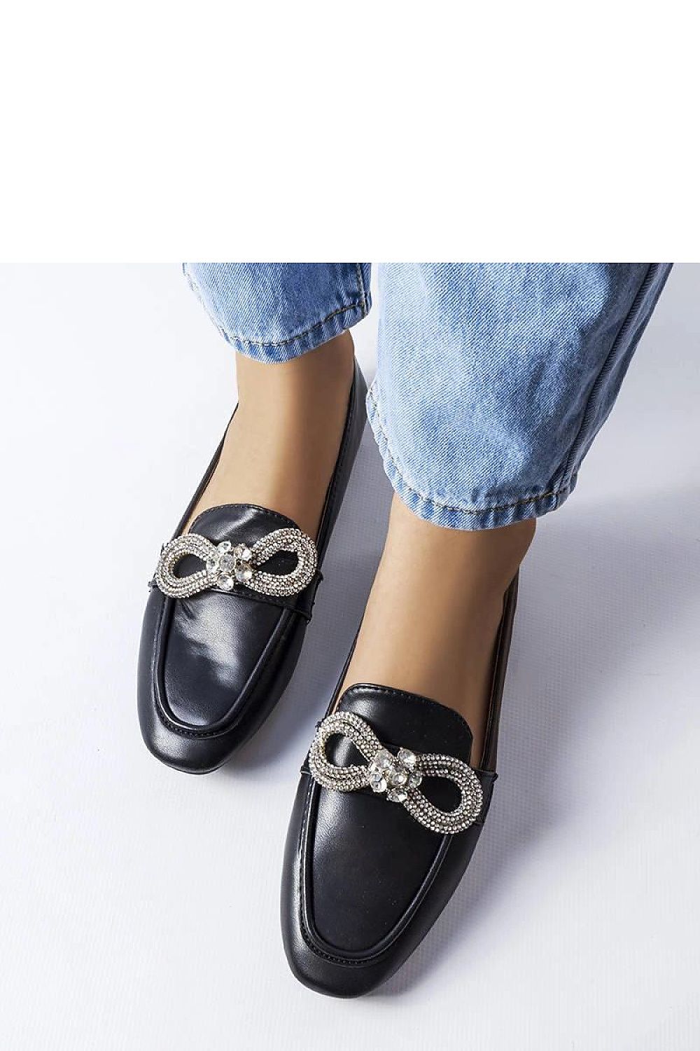 Solea's elegant black moccasins with stunning zircons, crafted from eco-friendly leather for a comfortable and stylish summer footwear option.