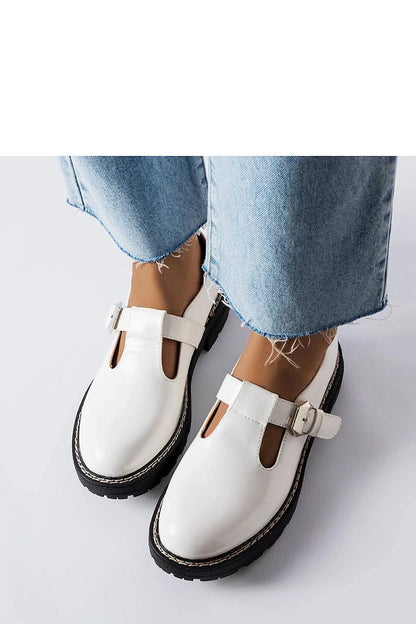 Close-up of luxury Vaden loafers in white patent leather by Solea, highlighting the sleek design and summer comfort features.