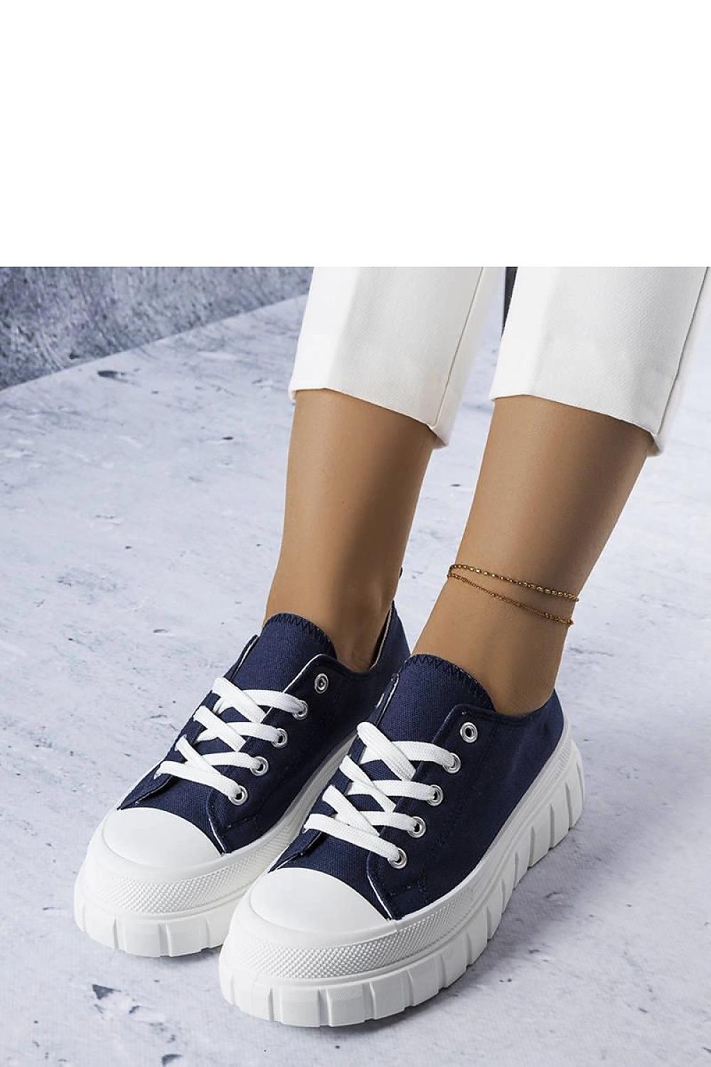 Elegant ankle-high navy blue platform sneakers from Solea, showcasing delicate stitching and a modern thick sole.