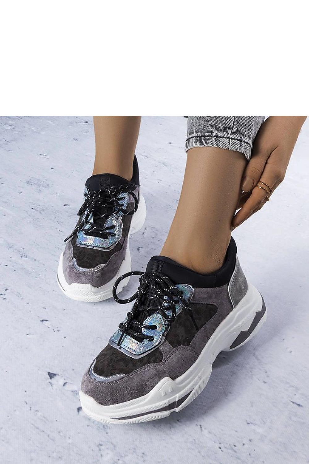 Close-up of the Solea gray sneakers showcasing unique Savard inserts and comfortable rubber sole design.