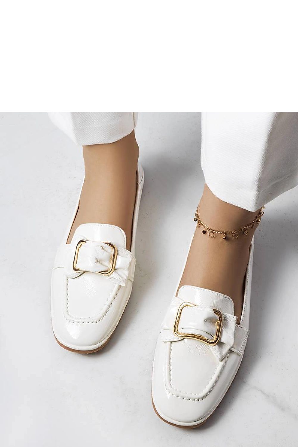 Elegant Erica White patent moccasins featuring stylish buckle and chain detail by Solea, crafted in eco leather for luxurious comfort.