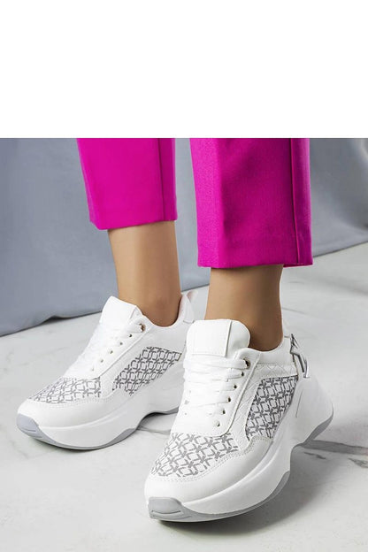 Close-up of Solea luxury white sneakers featuring the Margie monogram, crafted for ultimate comfort and chic summer style.