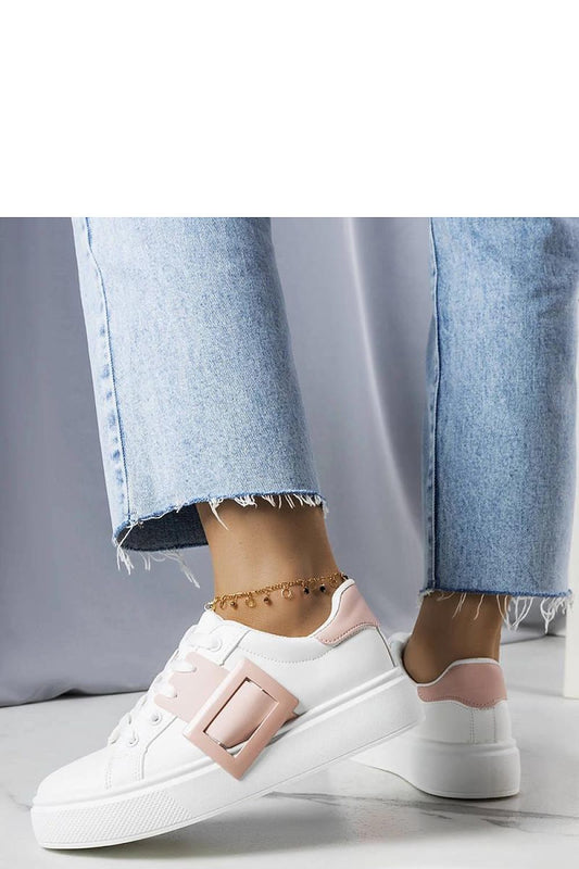 Luxury white sneakers by Solea featuring a chic pink buckle, perfect for stylish summer outfits.