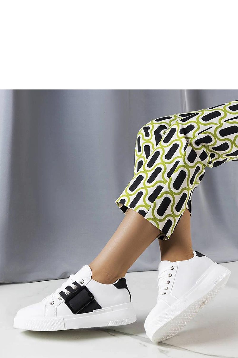 Elegant white sneakers from Solea with a contrasting black buckle, designed for comfort and effortless summer style in sizes EU 36-41.