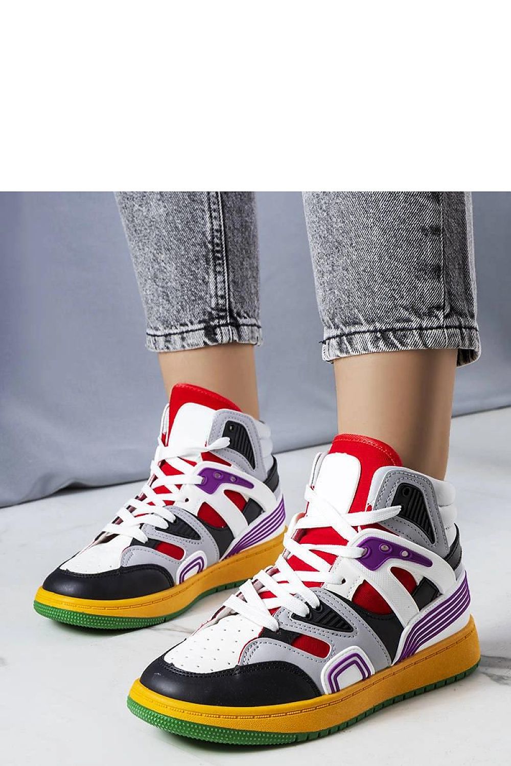 Close-up of Solea Marjorie high-top sneakers featuring pristine white fabric and bold red rubber sole, perfect for pairing with chic summer outfits.