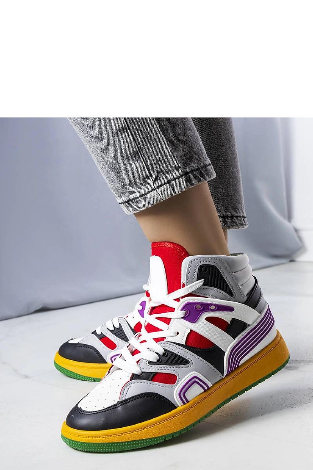 Solea high-top sneakers in white with red rubber sole displayed in a luxurious setting, epitomising comfort and timeless style.