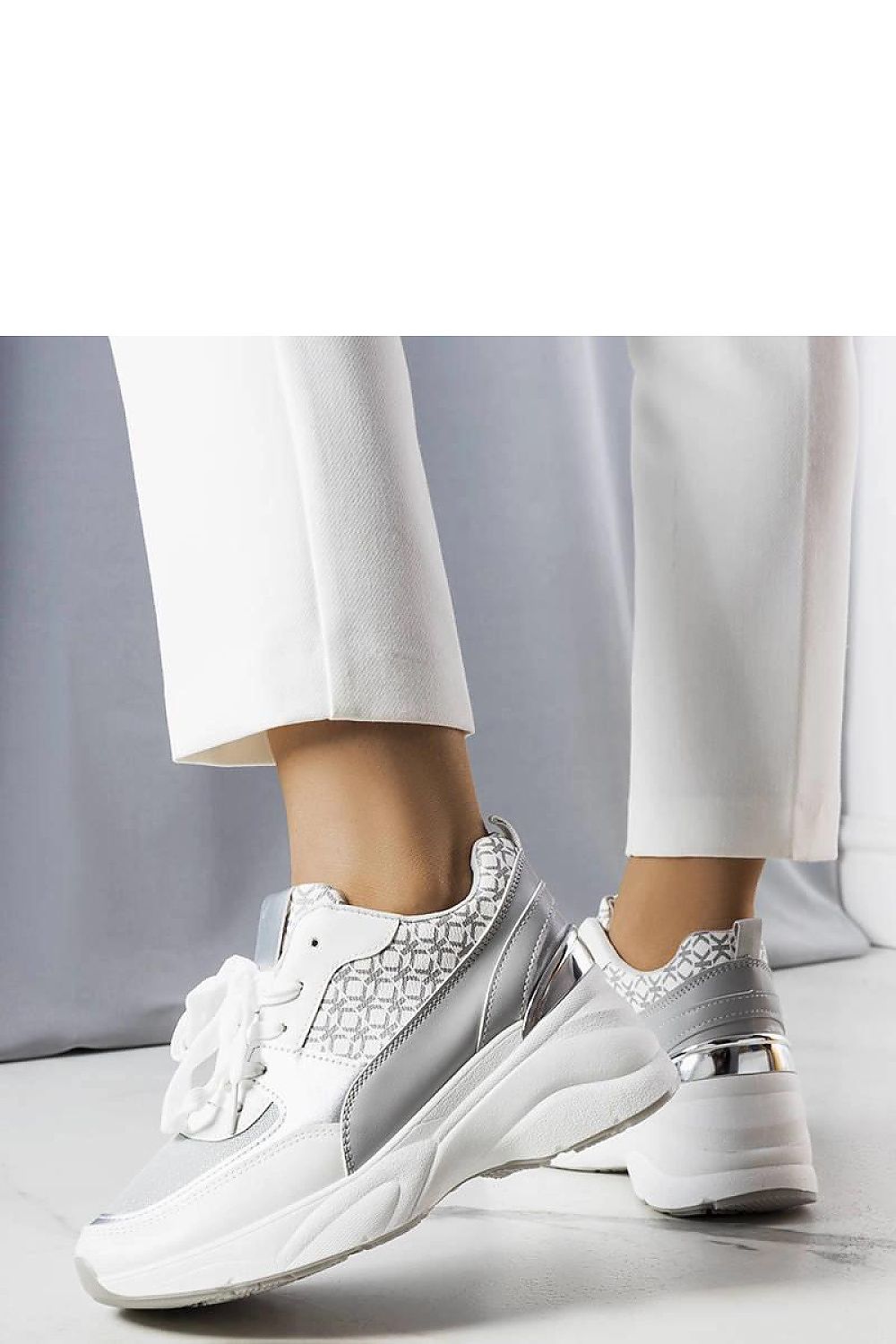 Elegant close-up of Solea Grey Sneakers adorned with Lora Hurtado's monogram, showcasing high-quality craftsmanship and summer-ready fashion.