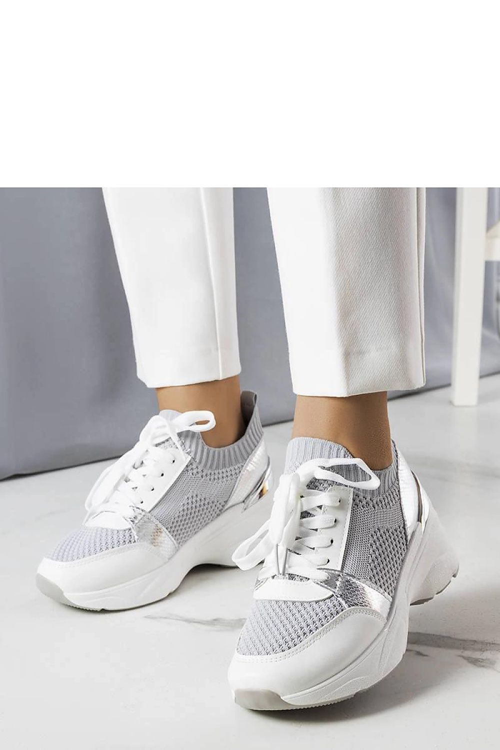 Solea Women's Pink Wedge Sneakers styled with casual summer outfits, ideal for walks or social gatherings in warm weather.