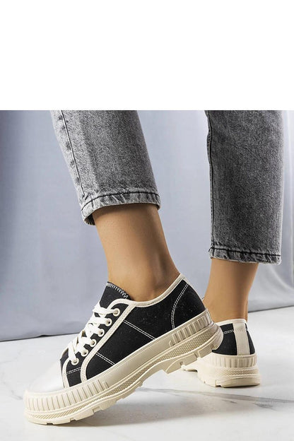 Side profile of luxury black platform sneakers Nichole by Solea, highlighting the decorative rubber toe and elegant silhouette.