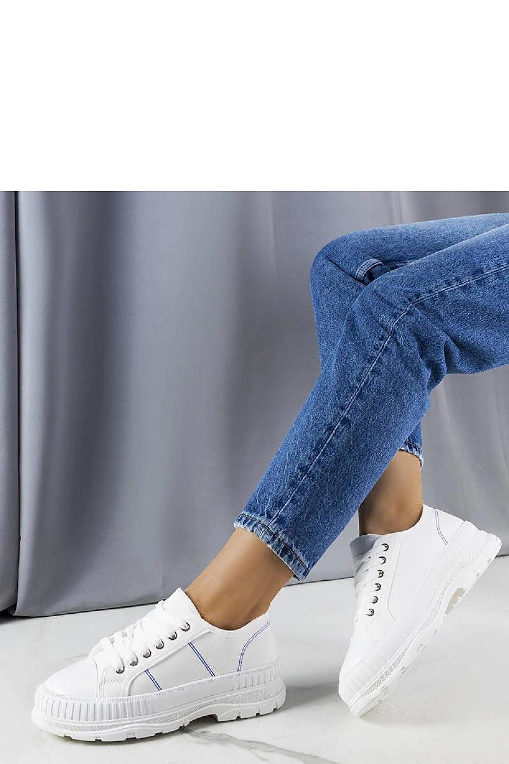 Solea black platform sneakers Nichole in a flat lay arrangement, focusing on the luxurious fabric and unique platform height.