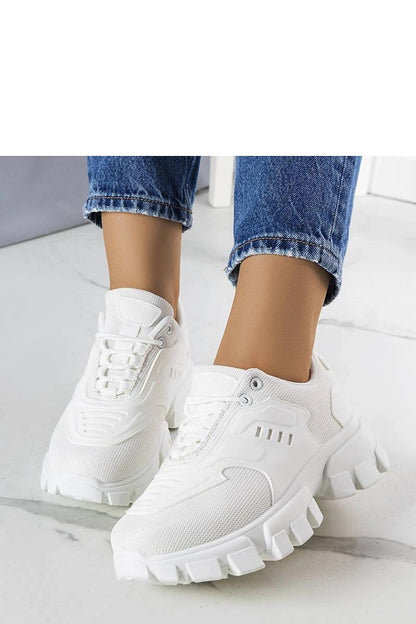 Elegant Solea white sneakers with a lace-up closure, showcasing comfort and style for trendy summer outfits.