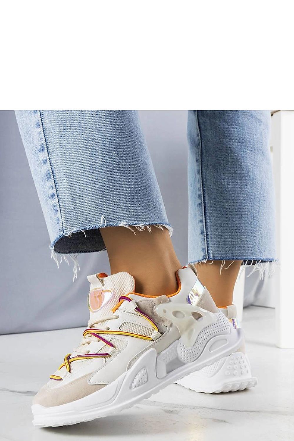 Close-up of Solea's luxury beige sneakers showcasing the durable rubber sole and traditional lace fastening for a perfect fit.