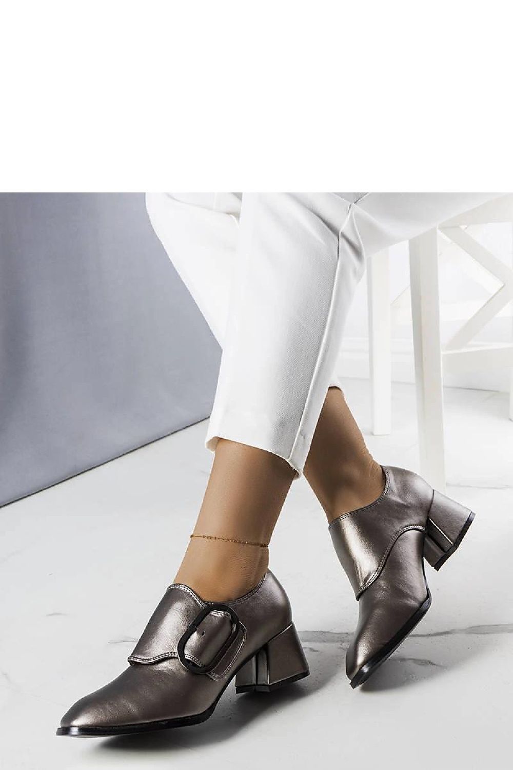 Chic Solea grey heel pumps featuring square toe and buckle detail, designed for comfort and sophistication in business settings.