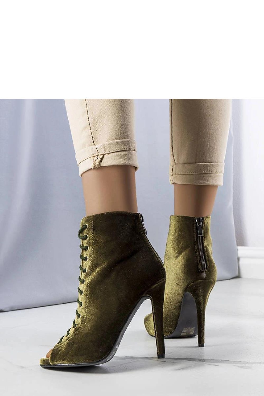 Close-up of Solea's Amora velvet ankle boots showcasing exquisite lace detail and rear zipper, designed for comfort and style.