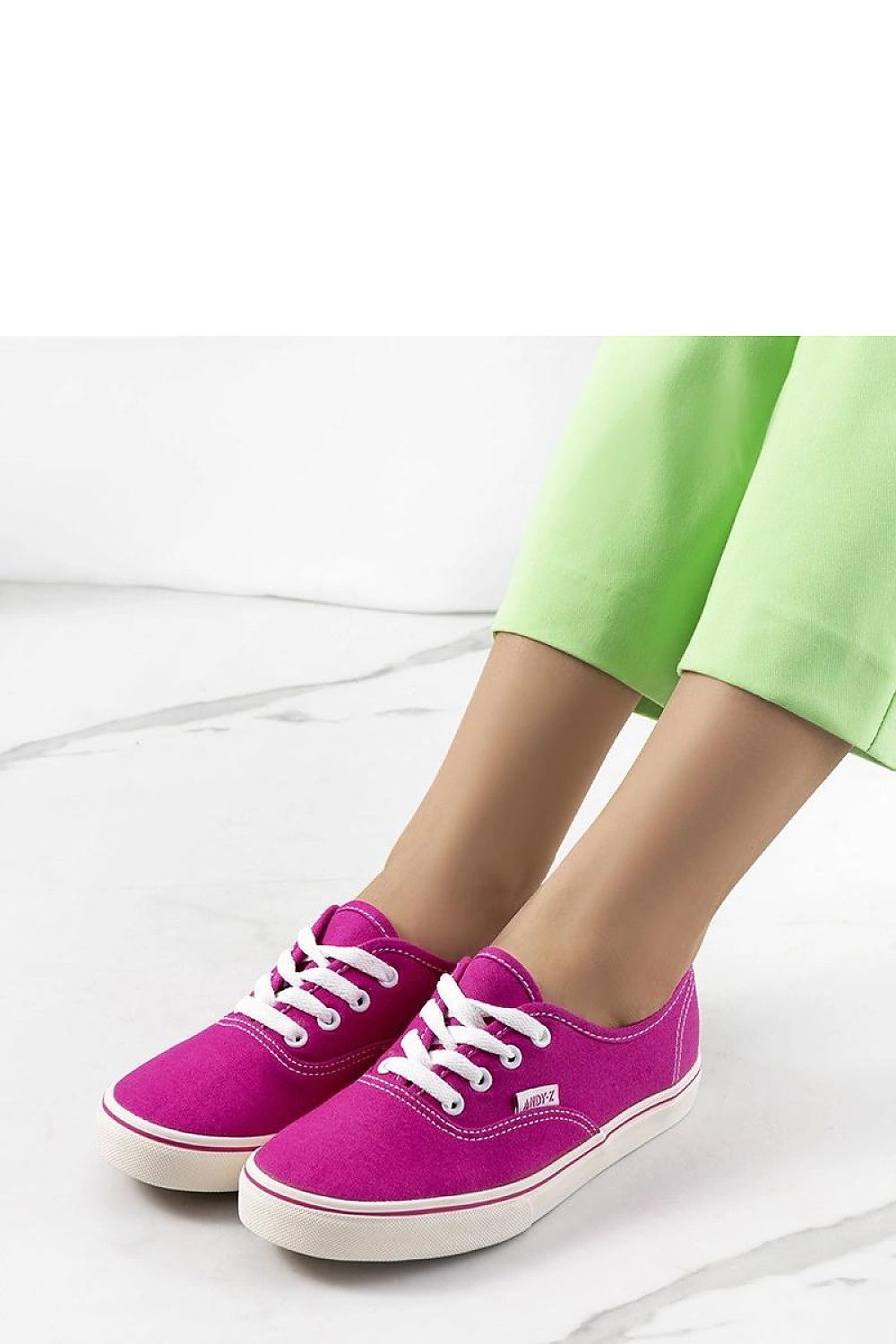 Chic Solea Pink Emall Sneakers displayed against a fashionable summer backdrop, highlighting comfort and stylish pink fabric for women.