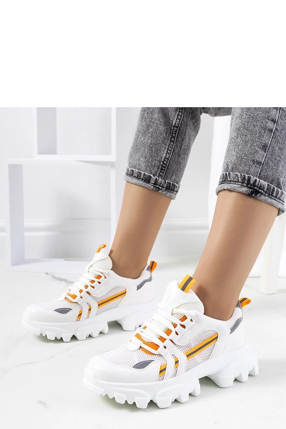 Solea's luxury white women's sneakers Bernier showcasing reflective accents and a durable white rubber sole, ideal for both casual and sporty looks.