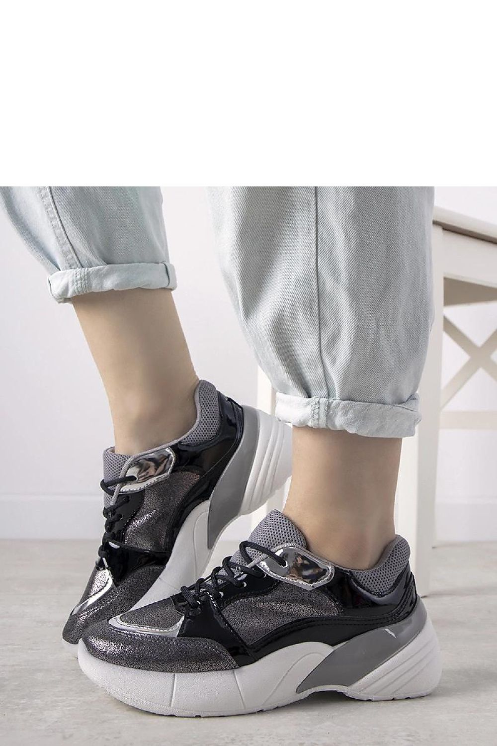 Elegant Solea Rude silver eco-leather sneakers with a sporty high sole, perfect for adding character to autumn outfits.