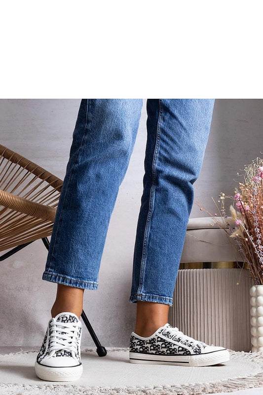 Elegant Solea Rimmie women's sneakers in classic black and white, showcasing sophisticated design and comfort, perfect for stylish autumn and winter outfits.