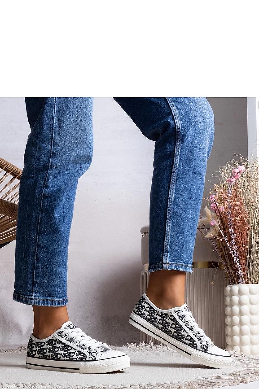 Close-up of Solea Rimmie black and white sneakers, highlighting the intricate upper design and lace-up closure for a chic and refined look.