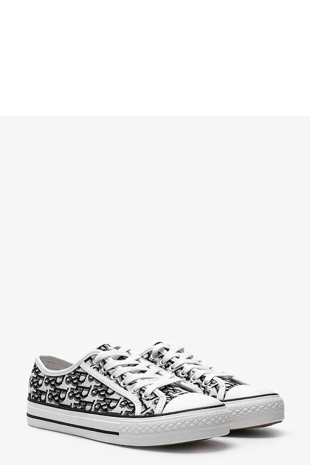 Solea Rimmie women's sneakers displayed against a neutral background, emphasising the flexible white rubber sole and versatile fashion appeal.