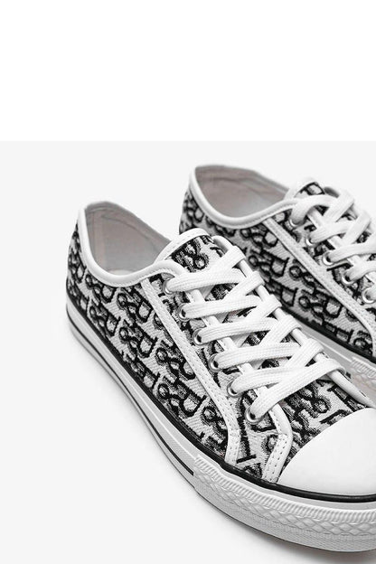 Elegant Solea Rimmie Women's Sneakers in classic black and white, featuring a stylish lace-up closure and a flexible white rubber sole, perfect for adding sophistication to your autumn and winter outfits.