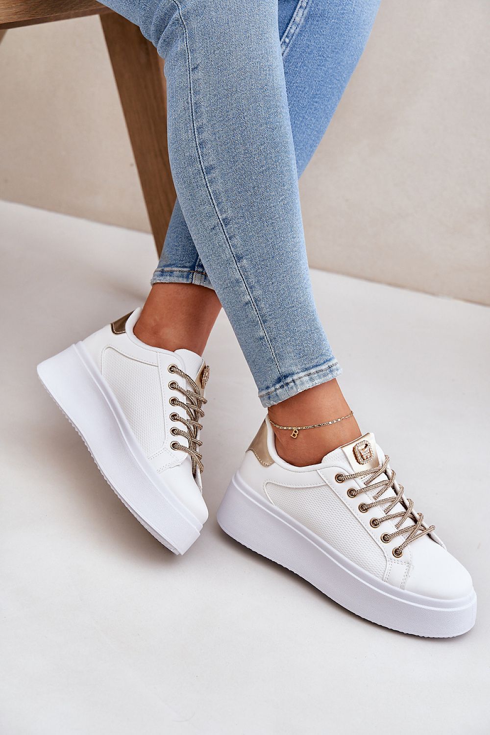 Stylish women's luxury eco leather sneakers from Step in Style, showcasing a fashionable platform and eye-catching shiny lacing details.