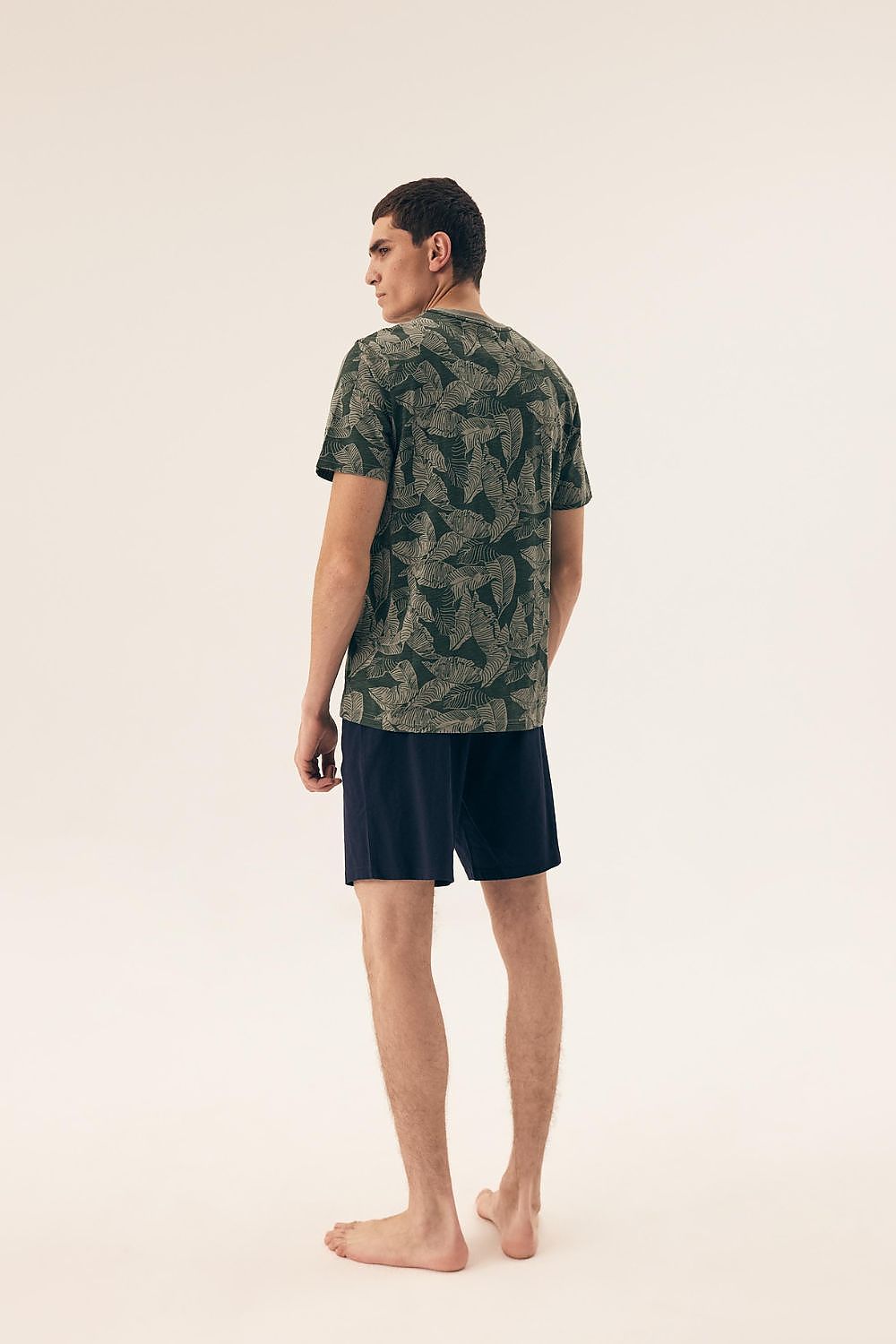 Luxurious men's camouflage pajama set by Henderson, crafted from soft cotton, featuring a stylish t-shirt with a trendy camouflage print and comfortable shorts for ultimate sleep comfort.