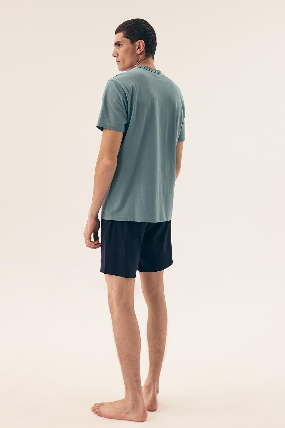 Elegant sleepwear set for men by Henderson, showcasing a classic round neckline and comfortable shorts design ideal for temperature regulation.