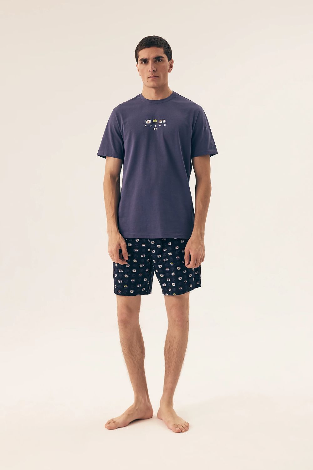 Luxury Henderson Men's Cotton Pyjamas Set showcasing soft and breathable fabric, featuring a classic round neck t-shirt and stylish printed shorts, perfect for comfortable and relaxing sleep.