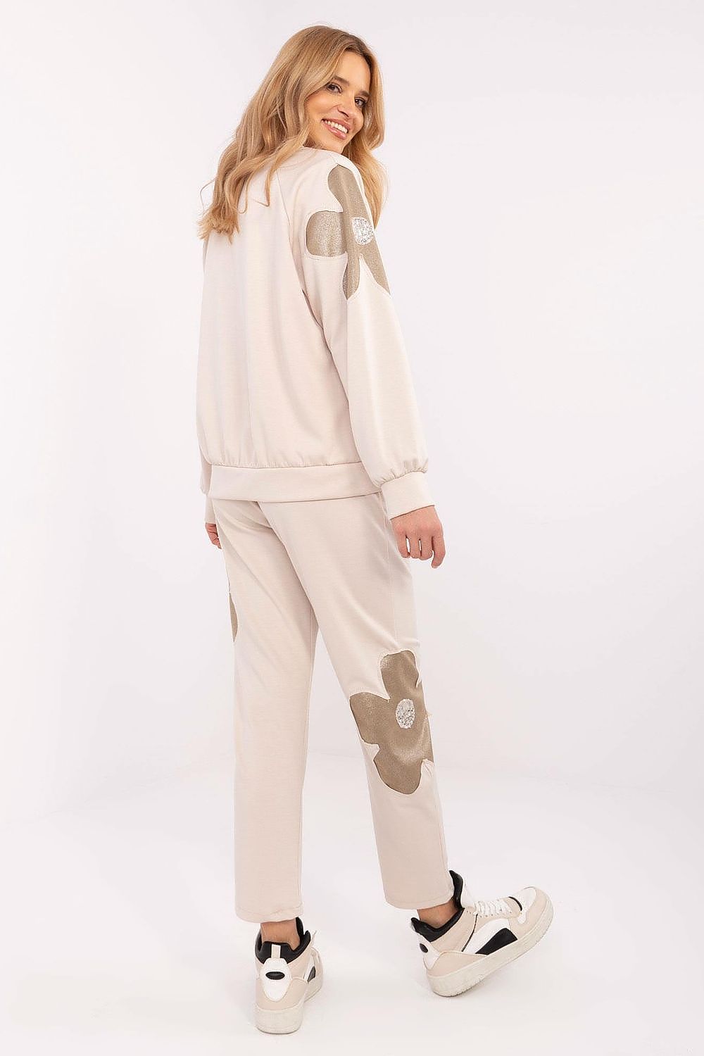 Elegant luxury women's tracksuit set from Italy Moda, showcasing a blend of soft fabrics and delicate zircon embellishments for a chic casual look.
