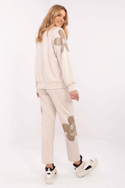 Elegant luxury women's tracksuit set from Italy Moda, showcasing a blend of soft fabrics and delicate zircon embellishments for a chic casual look.
