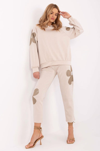 Luxury floral tracksuit set for women by Italy Moda featuring a high-waisted pants and long-sleeve hoodie ensemble.