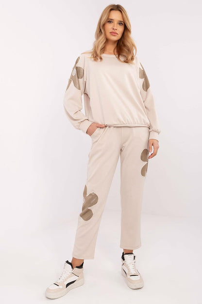 Luxury women's tracksuit set with zircon flower inserts by Italy Moda, featuring a classic round neckline sweatshirt.