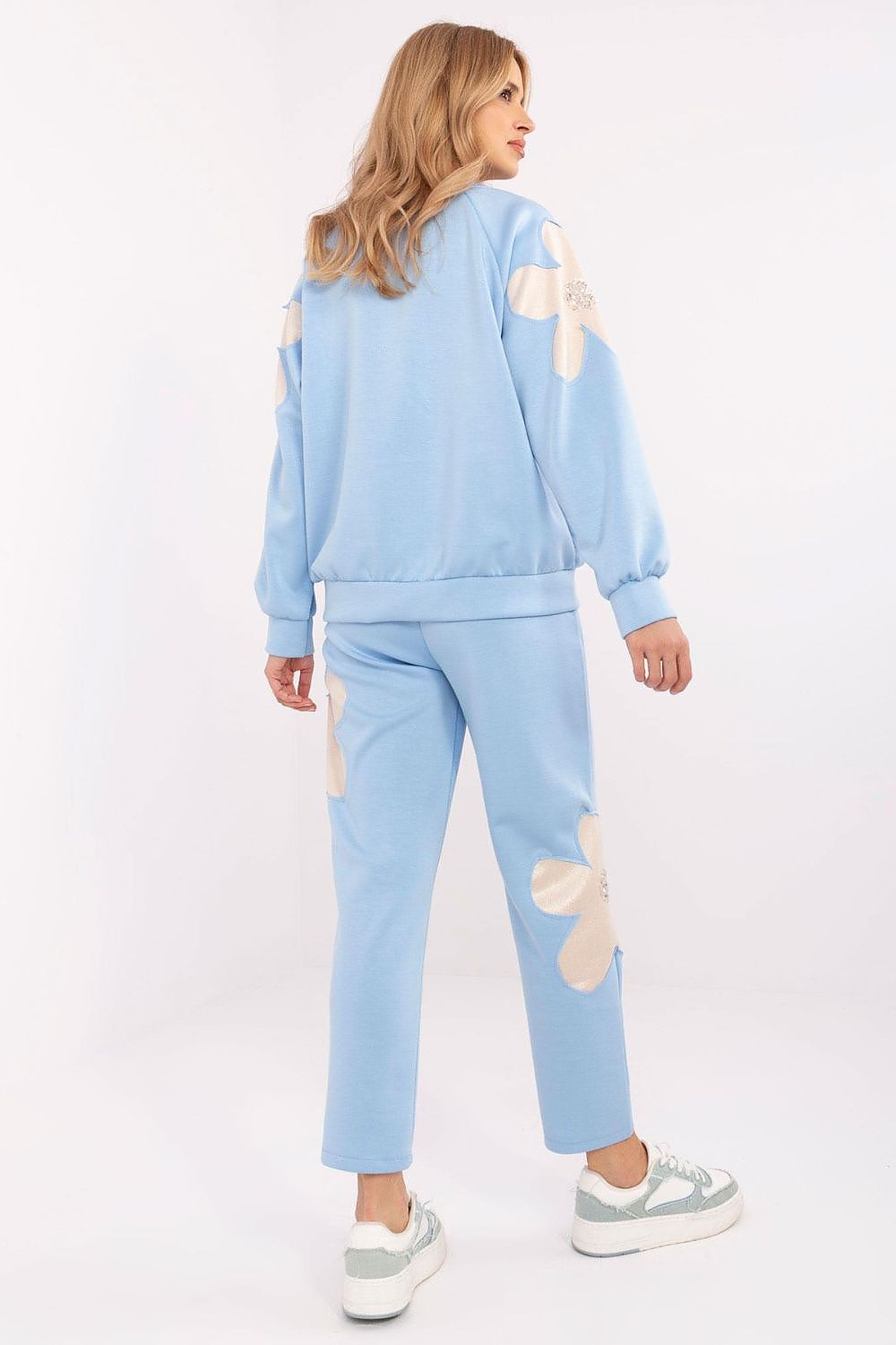 Elegant Italy Moda women's tracksuit set made from a soft viscose blend, highlighting the detailed zircon flower embellishments and practical design elements.