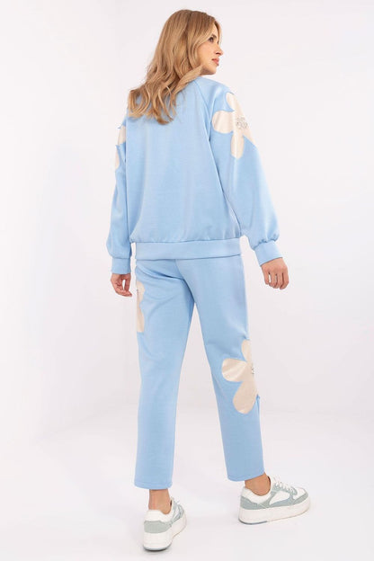 Elegant Italy Moda women's tracksuit set made from a soft viscose blend, highlighting the detailed zircon flower embellishments and practical design elements.