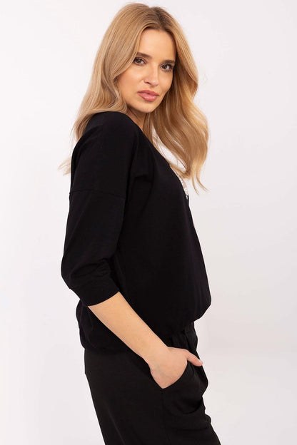 Close-up of the luxurious embroidery and pearl detailing on a cotton blend blouse by Relevance, perfect for adding elegance to any outfit.