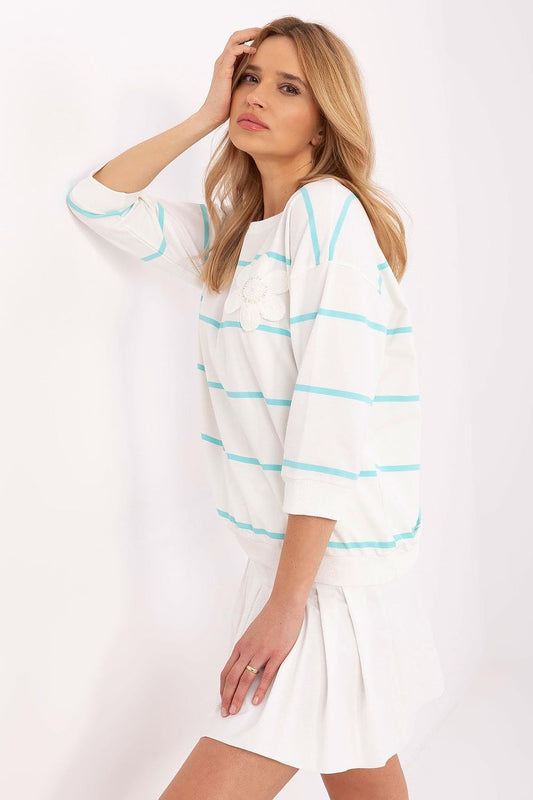 Stylish cotton blouse by Relevance in classic stripes, designed with 3/4 sleeves and a delicate flower patch for refined casual wear.