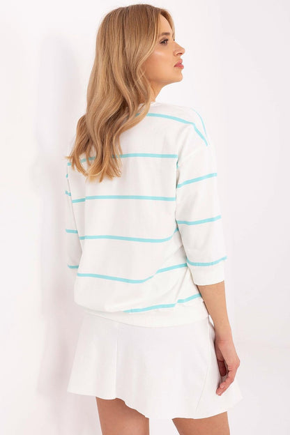 Sophisticated 3/4 sleeve cotton blouse by Relevance, adorned with a flower patch, perfect for versatile styling from work to leisure.