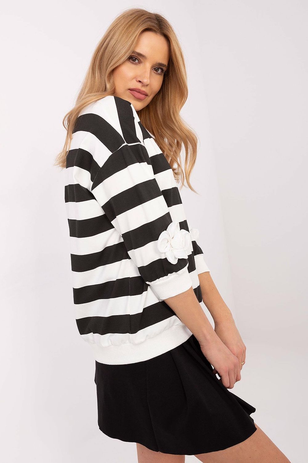 Chic floral patch details on a Relevance striped cotton blouse, ideal for various stylish outfits.