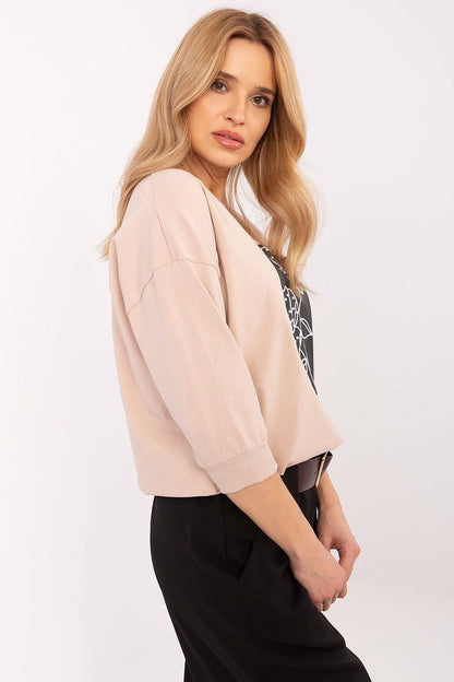 Stylish Relevance blouse styled with elegant trousers, showcasing its versatility for both casual and formal occasions.