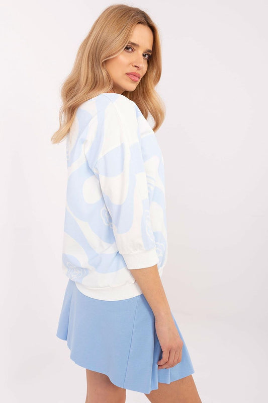 Close-up detail of Relevance's women's floral print blouse, showcasing the delicate pattern and comfortable fabric blend of cotton and elastane.