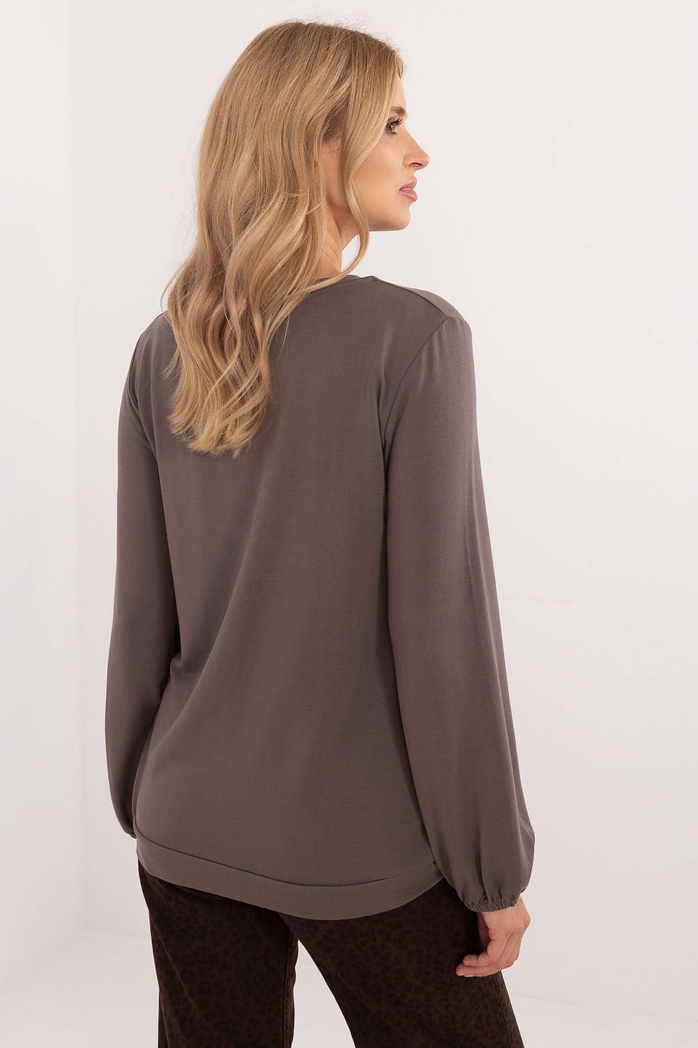 Close-up view of the soft micro modal fabric blended with spandex, highlighting the exceptional comfort and elegance of the Relevance blouse.