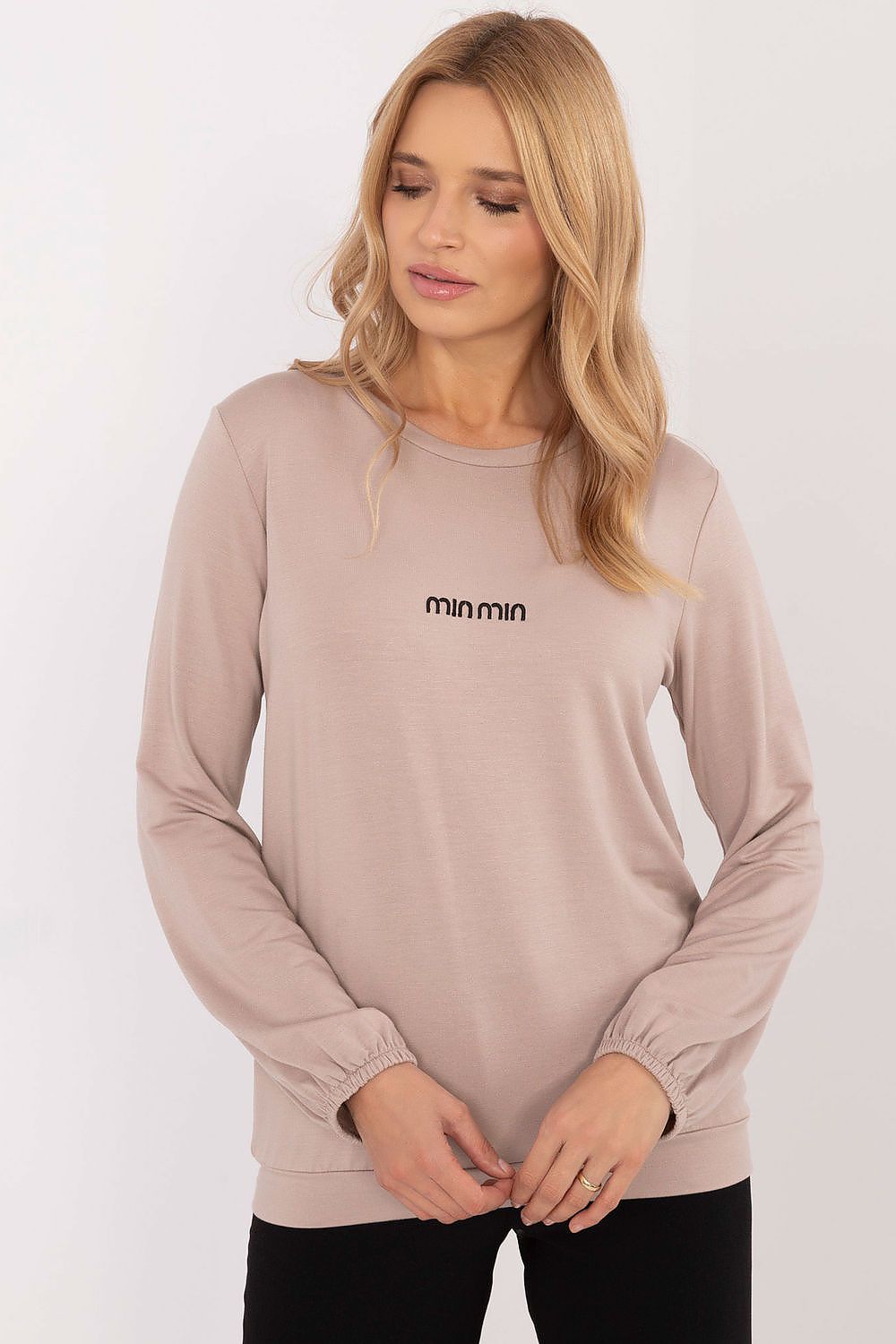 Model wearing the long sleeve micro modal blouse from Relevance, styled for an elegant and casual look, perfect for everyday outings.