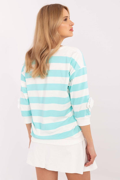 Stylish striped cotton blouse by Relevance, featuring decorative floral patches on the sleeves for added sophistication.