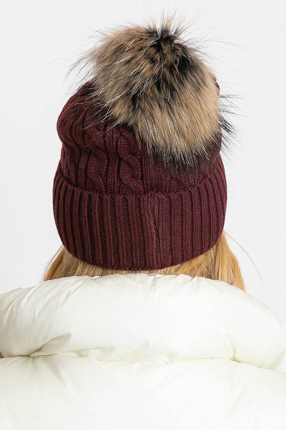 Stylish winter hat by AT, featuring a generous cuff and fluffy pompom, expertly made with an opulent blend of 50% acrylic, 30% cotton, and 20% cashmere.